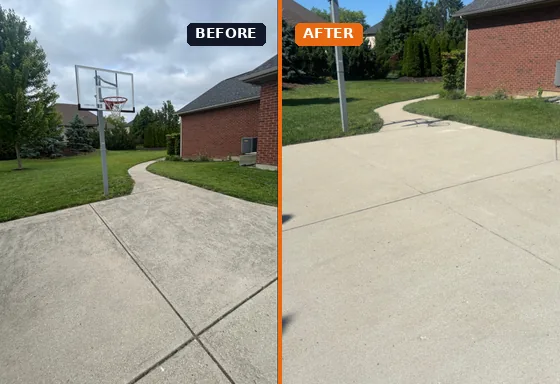 Concrete driveway pressure washing before and after in Centerville, Ohio by A Team Contracting